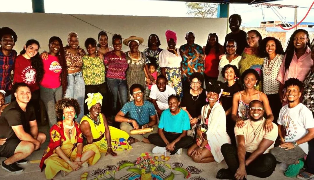 large group of people standing or sitting posing for photo